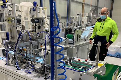 Care Essentials employee in production facility