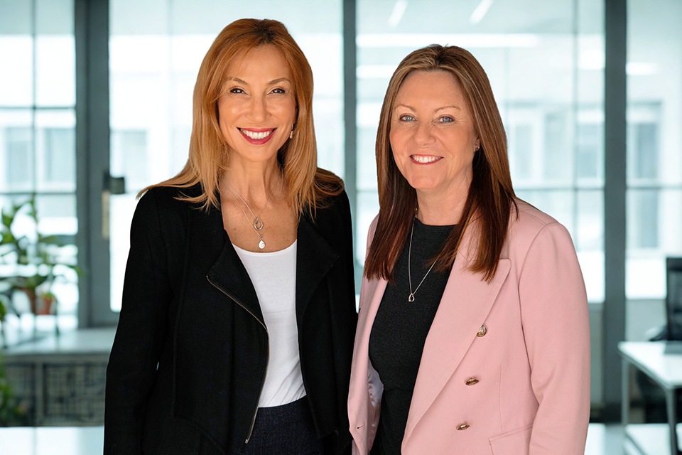 Two women smiling 