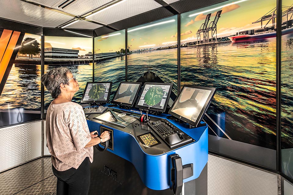 Portable high-fidelity maritime simulator in use by a person