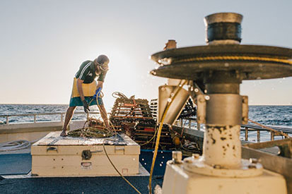 Woman working on fishing boat