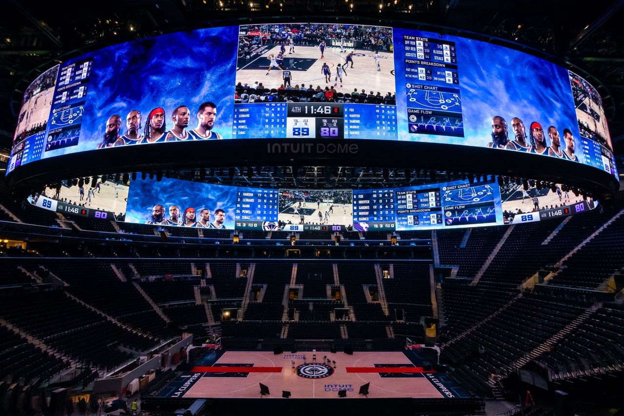 A high-definition sports screen above a basketball court