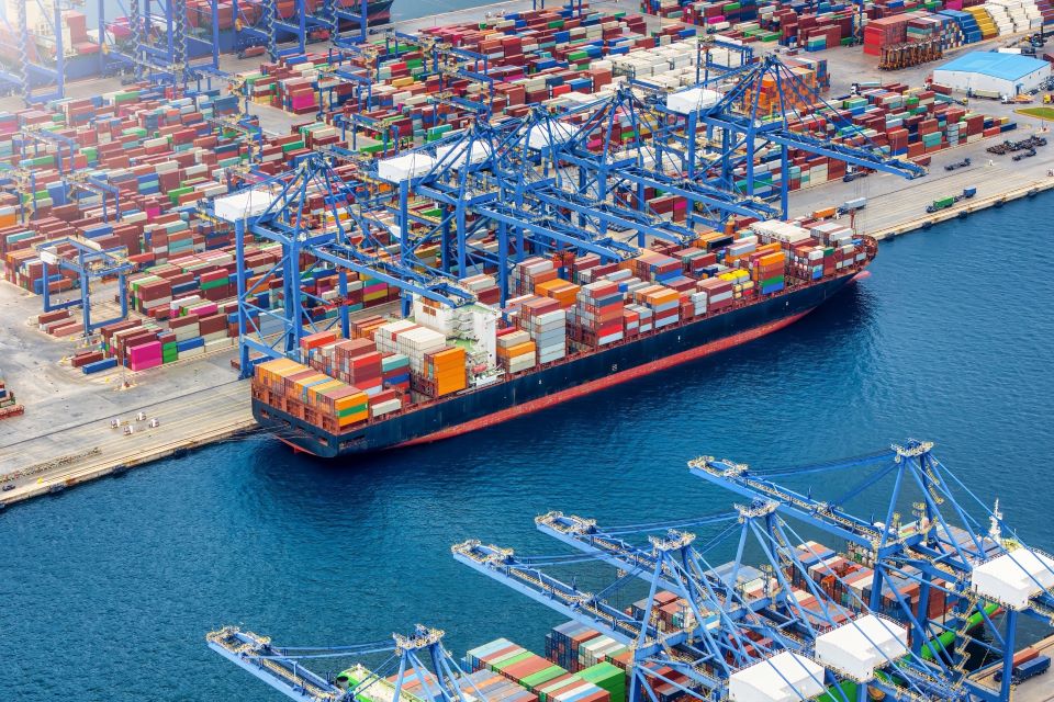 A container shipped docked at a wharf