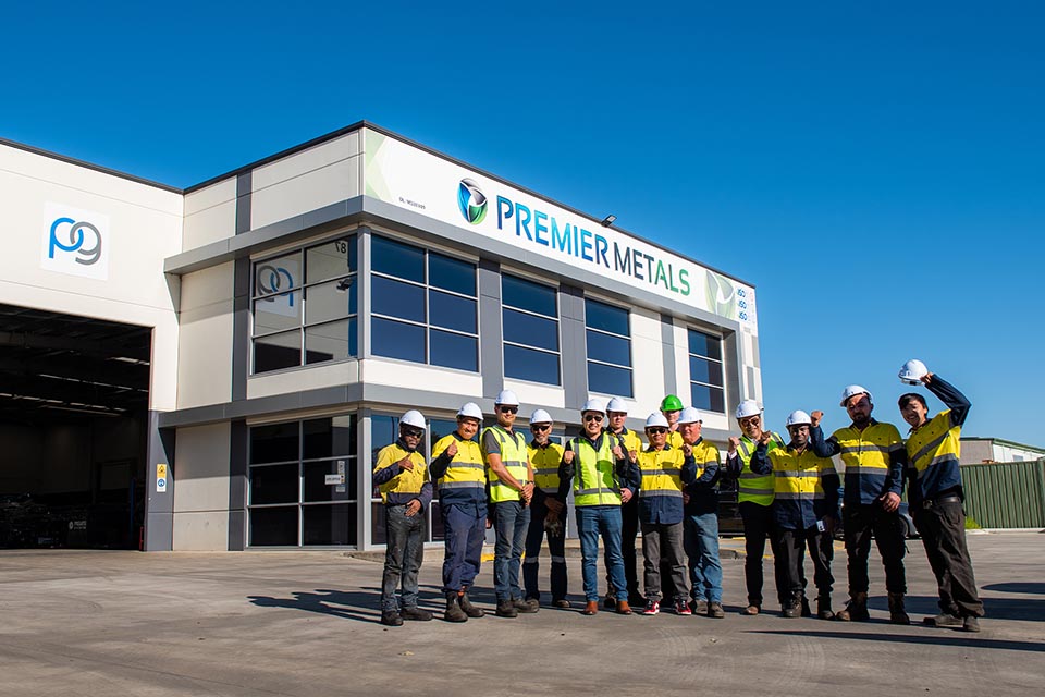 Group of staff standing outside Prermier Metal Recyclers factory