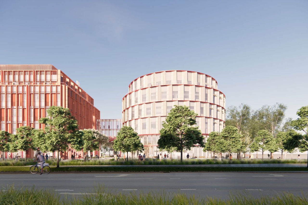 a artist image render showing a round shaped building next to a red brick square building joined by an elevated glass walkway