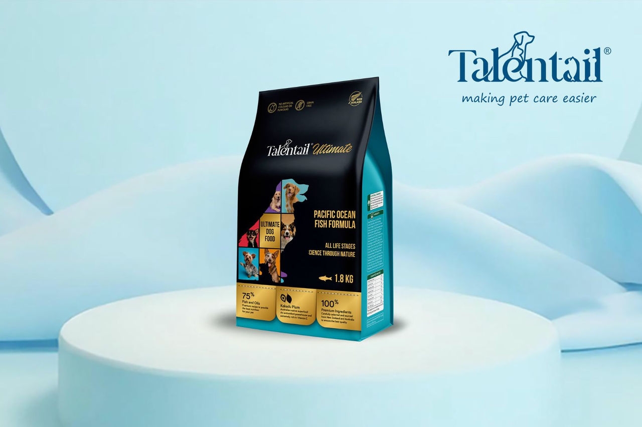 A packet of dog food positioned in front of a light blue background