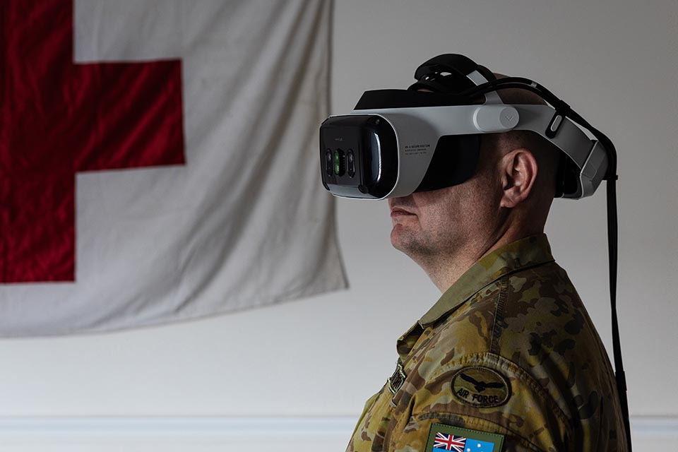 Person in army uniform wearing mixed reality goggles