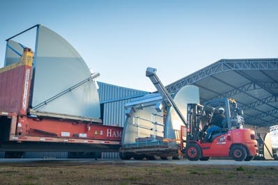 Water management equipment being loaded on trucks.