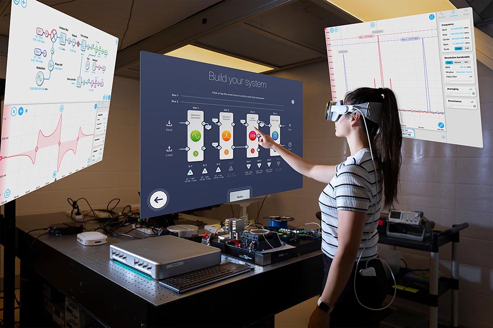 Person wearing virtual reality goggles while touching a screen