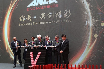 Executives at podium opening ANCA Asia headquarters in Shanghai.