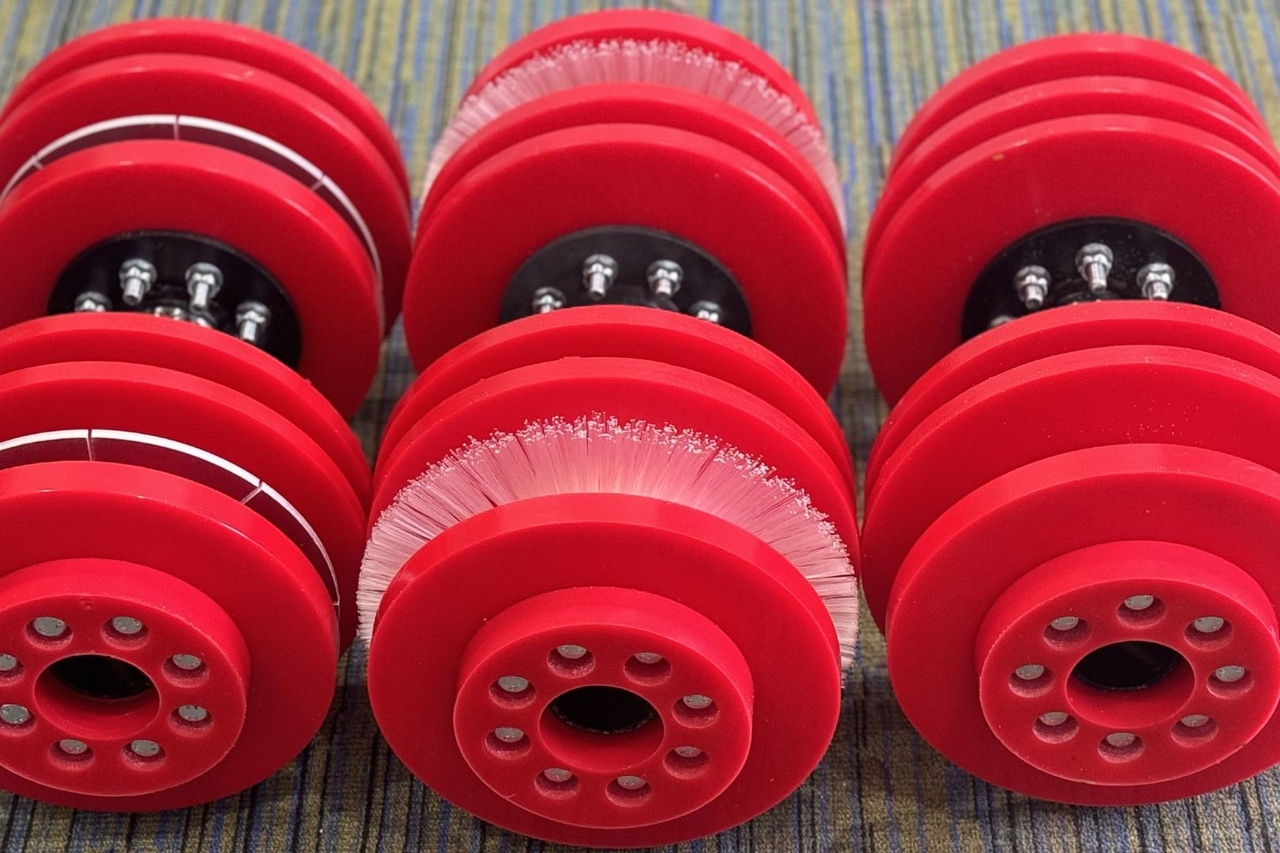 Round, red poly plastic pipeline pigs for clearing blockages in pipes