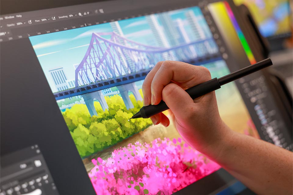 Person creating artwork use a digital stylus and screen